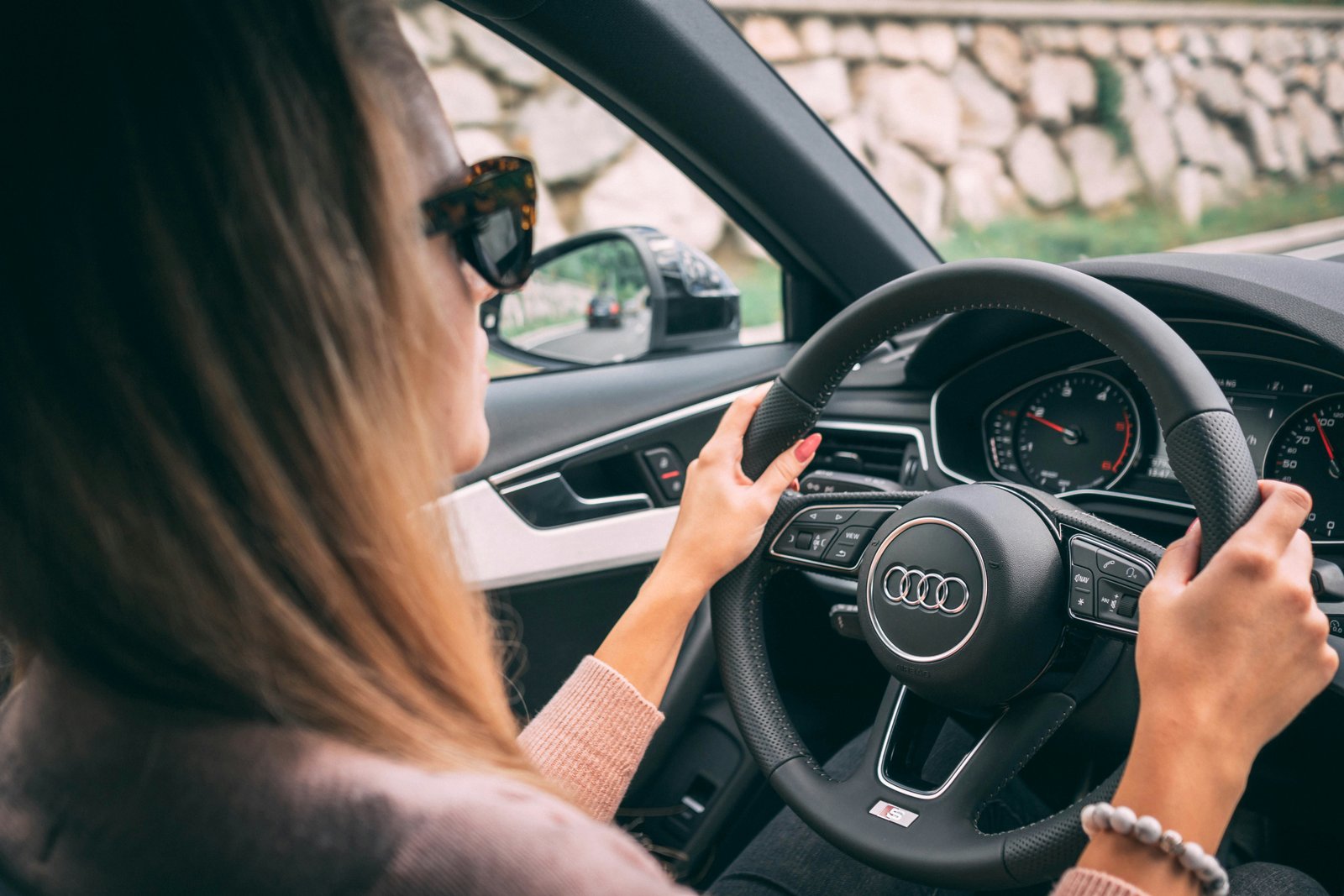 Student hands on the steering wheel during a lesson